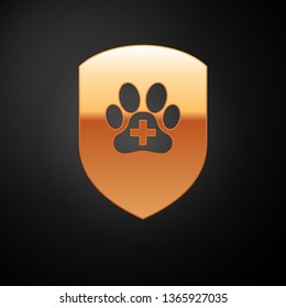 Gold Animal health insurance icon isolated on black background. Pet protection icon. Dog or cat paw print. Vector Illustration