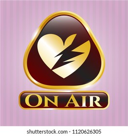  Gold badge with broken heart icon and On Air text inside