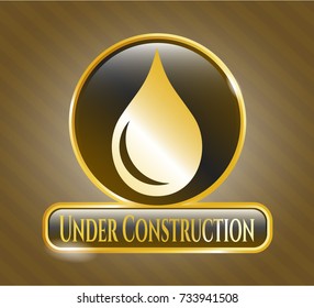 Gold badge with drop icon and Under Construction text inside