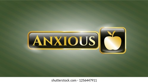  Gold badge or emblem with apple icon and Anxious text inside
