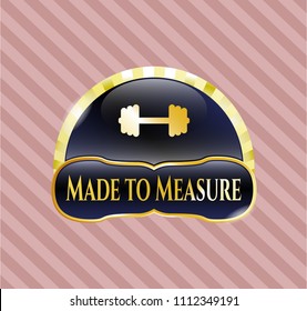   Gold badge or emblem with big dumbbell icon and Made to Measure text inside