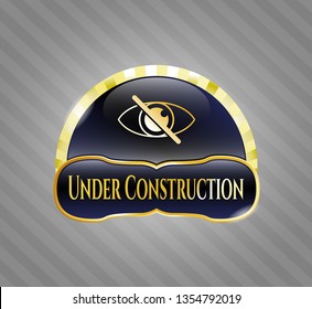  Gold badge or emblem with blind icon and Under Construction text inside