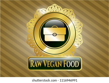  Gold badge or emblem with briefcase icon and Raw Vegan Food text inside
