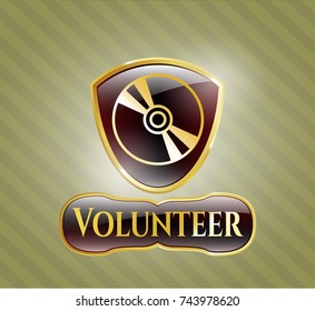  Gold badge or emblem with CD or DVD disc icon and Volunteer text inside