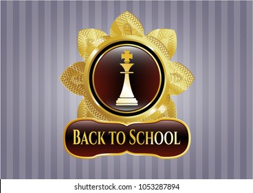   Gold badge or emblem with chess king icon and Back to School text inside