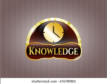  Gold badge or emblem with Clock (Time) icon and Knowledge text inside