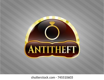  Gold badge or emblem with diamond ring icon and Antitheft text inside
