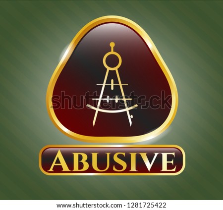  Gold badge or emblem with drawing compass icon and Abusive text inside