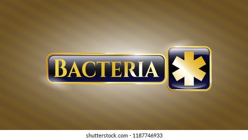  Gold badge or emblem with emergency cross icon and Bacteria text inside
