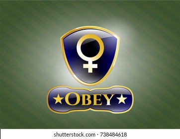  Gold badge or emblem with female icon and Obey text inside