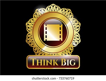  Gold badge or emblem with film icon and Think Big text inside