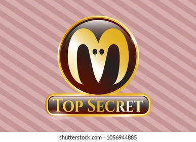  Gold badge or emblem with goat head icon and Top Secret text inside