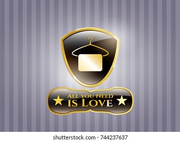  Gold badge or emblem with hanger with towel icon and All you Need is Love text inside