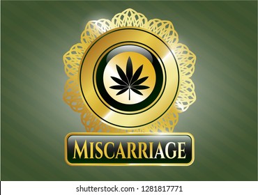  Gold badge or emblem with marijuana leaf icon and Miscarriage text inside