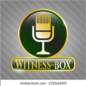  Gold badge or emblem with microphone icon and Witness-box text inside