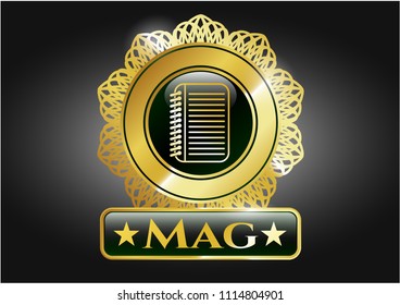  Gold badge or emblem with note book icon and Mag text inside