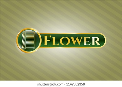  Gold badge or emblem with note book icon and Flower text inside