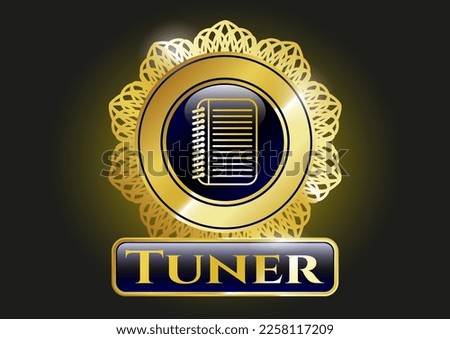 Gold badge or emblem with note book icon and Tuner text inside