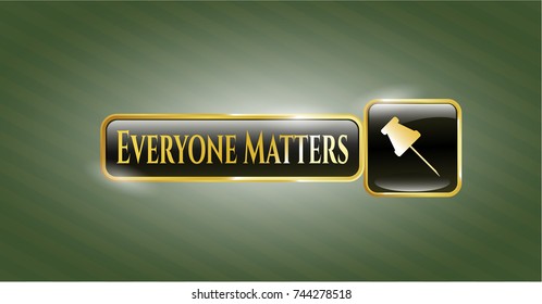  Gold badge or emblem with paper pin icon and Everyone Matters text inside