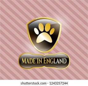  Gold badge or emblem with paw icon and Made in England text inside