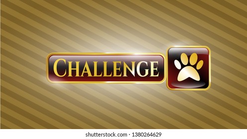  Gold badge or emblem with paw icon and Challenge text inside