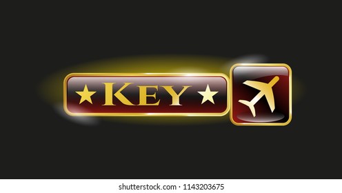  Gold badge or emblem with plane icon and Key text inside