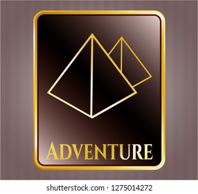  Gold badge or emblem with pyramids icon and Adventure text inside