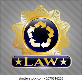   Gold badge or emblem with recycle icon and Law text inside