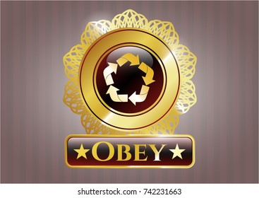  Gold badge or emblem with recycle icon and Obey text inside