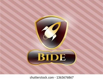  Gold badge or emblem with rocket icon and Bide text inside