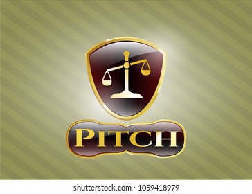  Gold badge or emblem with scale icon and Pitch text inside