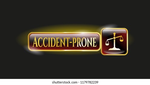  Gold badge or emblem with scale icon and Accident-prone text inside