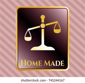  Gold badge or emblem with scale icon and Home Made text inside