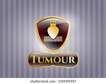  Gold badge or emblem with ship icon and Tumour text inside