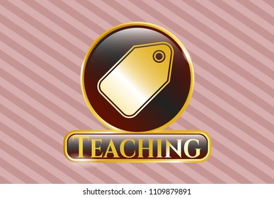   Gold badge or emblem with tag icon and Teaching text inside