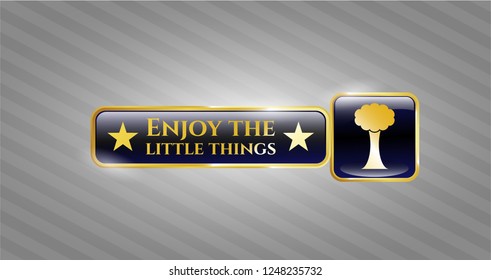  Gold badge or emblem with tree icon and Enjoy the little things text inside