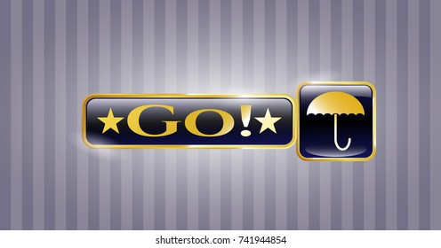  Gold badge or emblem with umbrella icon and Go! text inside
