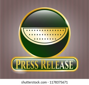  Gold badge or emblem with watermelon icon and Press Release text inside
