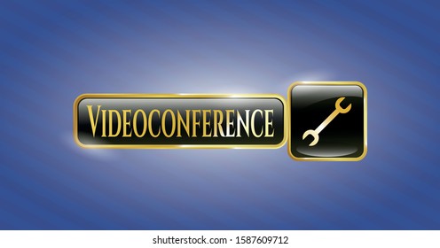 Gold badge or emblem with wrench icon and Videoconference text inside