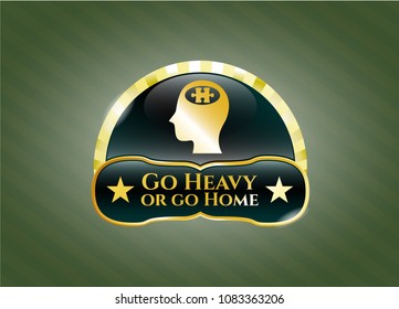  Gold badge with head with jigsaw puzzle piece icon and Go Heavy or go Home text inside