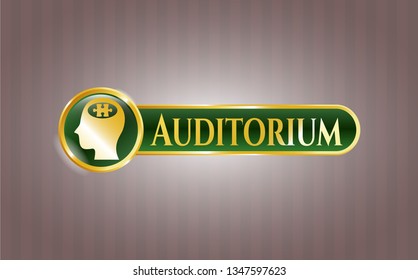  Gold badge with head with jigsaw puzzle piece icon and Auditorium text inside