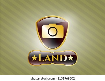 Gold badge with photo camera icon and Land text inside