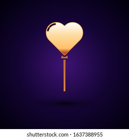Gold Balloons in form of heart with ribbon icon isolated on dark blue background.  Vector Illustration