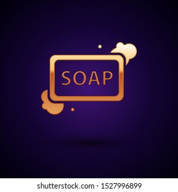 Gold Bar of soap with foam icon isolated on dark blue background. Soap bar with bubbles.  Vector Illustration