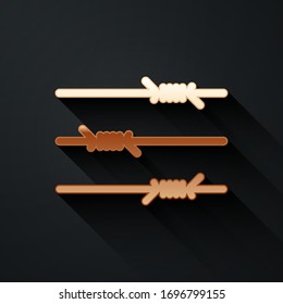 Gold Barbed wire icon isolated on black background. Long shadow style. Vector Illustration