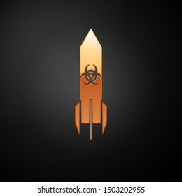 Gold Biohazard rocket icon isolated on black background. Rocket bomb flies down.  Vector Illustration