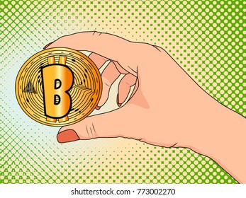 Gold bitcoin in the hand of a woman. Pop art dot, vector illustration