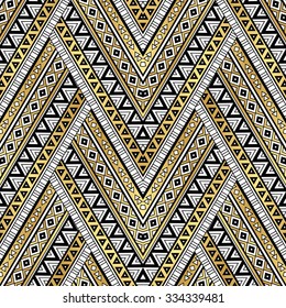 gold, black and white color tribal Navajo zigzag seamless pattern. aztec grunge abstract geometric art print. ethnic hipster backdrop. Wallpaper, cloth design, fabric, paper, wrapping, textile.  