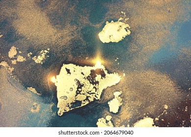 Gold and blue green abstract background. Alcohol ink marble texture with glitter. Template pattern for banner, poster design. Fluid art painting
