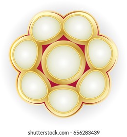 Gold brooch with pearls on a light background.